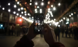 a man is taking a photo of himself on his phone