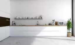 there is a room that has a large counter and a pot on the stove