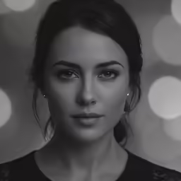 a young woman is posing with a very pretty hairdo and some eyes