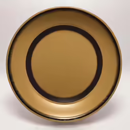 a black and gold plate with a white background