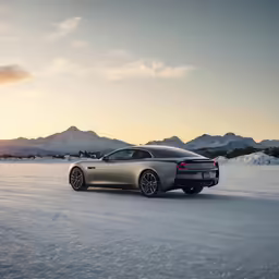 a car in the snow near a mountain