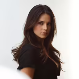 a woman that is posing for the camera