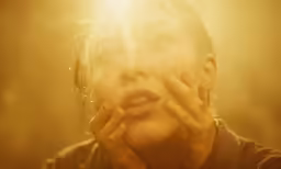 woman looking directly at her face as it looks on