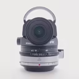 a camera lens on top of three cameras