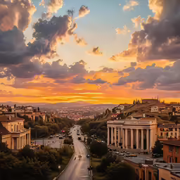 a city with large buildings at sunset