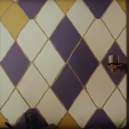 some purple and yellow tiles on the wall with a small vase