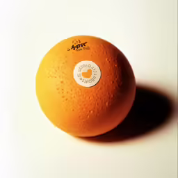 an orange with its peel off on the table