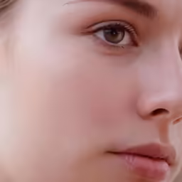 the head of a woman with a piercing on it
