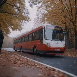 a big red and white bus driving down the street
