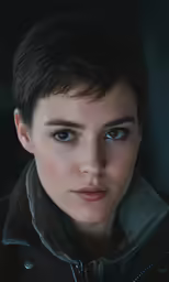 a woman that has a jacket on with a hood