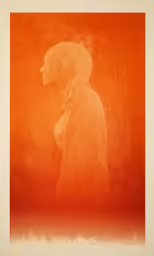 a person is shown with an orange background