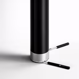 a small metal object on a white surface