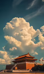 the forbidden city under an enormous, cloud filled sky