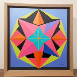 a painting that is hanging up on a wall,a painting with a triangle shaped design in a wooden frame,a large picture of a colorful geometric design,an art work is shown on the wall,a colorful picture made out of folded paper