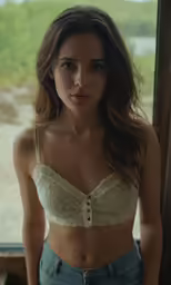a woman in a white bra top posing