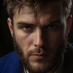 there is a man with a beard and blue jacket