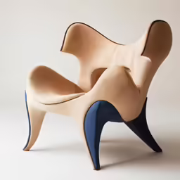 an open chair made from leather on a white background