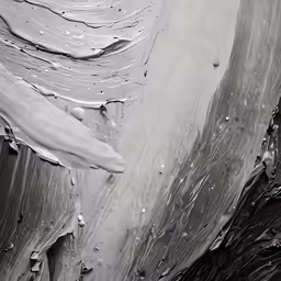 black and white photograph with water droplets on surface