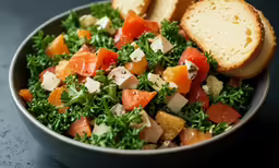 a bowl filled with salad and two slices of bread