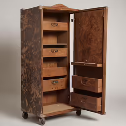 a large brown suitcase is open and it has drawers