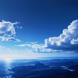 the view from above of some hills, cliffs, and sky