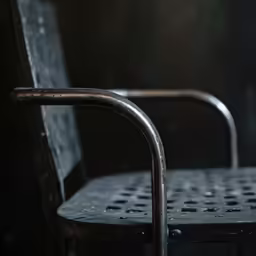 a metal chair that has been pushed down