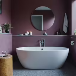 a bathroom with purple walls and grey floor