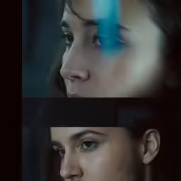 two women with their eyes opened and one has a face painted blue