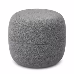 a small gray pouffe sitting on top of a white surface