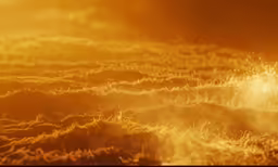 a group of animals standing in front of a yellow sky