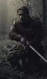 a man with a sword kneeling in the woods