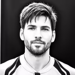 a black and white portrait of a young man
