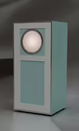 a white and grey speaker sitting inside of a box