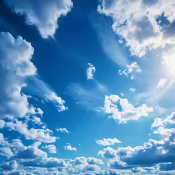 a very blue sky with some clouds above it