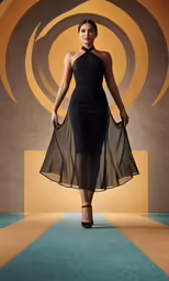 a woman standing in a black dress with an asymmetric design