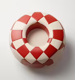 the red and white pattern is painted on a round object