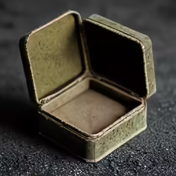 a small suitcase sitting on top of cement