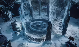 a tall tower standing next to a large wall covered in snow