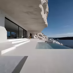 a house by the water with water views