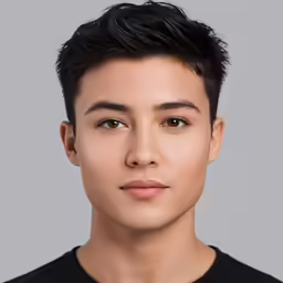 young boy with dark hair wearing a black t - shirt