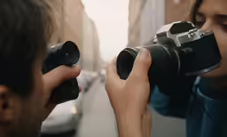 the photographer is taking pictures of a woman