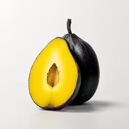 a black and yellow sliced fruit sitting next to each other