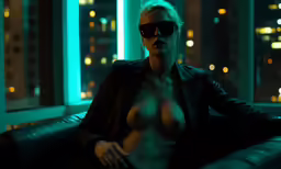 a very hot blonde woman with very small breast posing by some windows