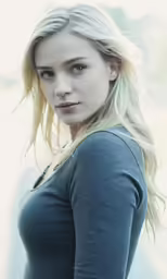 a beautiful blonde woman posing for a photo