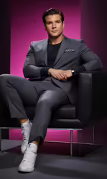 a man is sitting in a chair