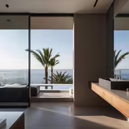 a bathroom with a large window that overlooks the ocean