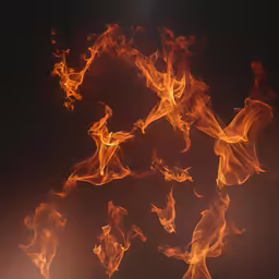 a very close shot of orange flames on a black background