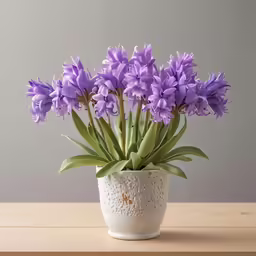 some purple flowers sitting on a table