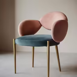 an armchair that has a blue seat and two pink seats on it