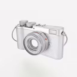 an old fashioned silver camera is hanging upside down